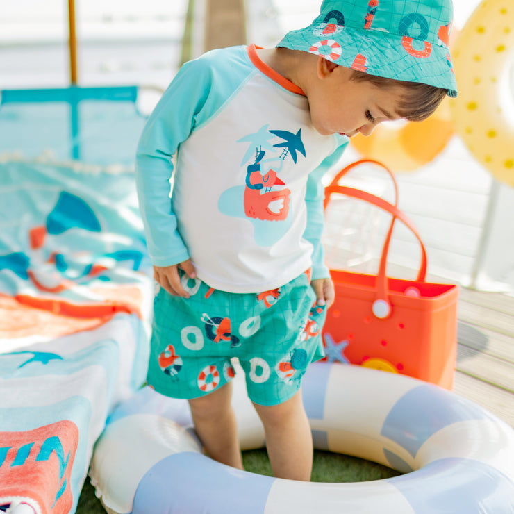 Blue swim shorts with flamingo all over print, baby