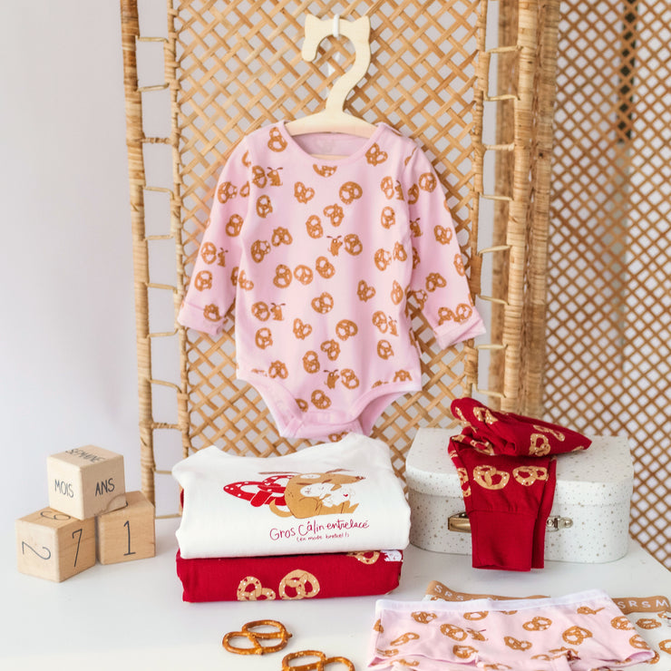 Pink Valentine's Day bodysuit in stretch jersey with pretzel all over print, baby