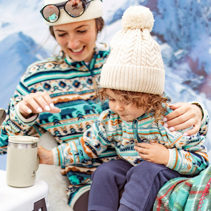 Cream knitted toque with a pompom, baby