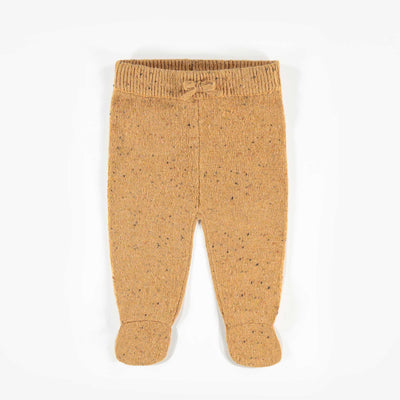 Pantalon brun à motifs, naissance