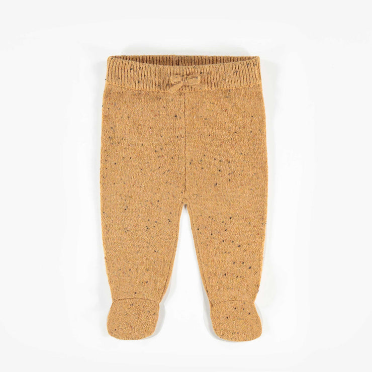 Pantalon brun à motifs, naissance